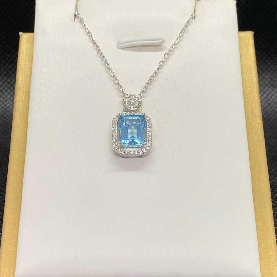 Natural Blue Topaz Halo Necklace in 925 Sterling Silver, 7×9mm Emerald-Cut Gemstone